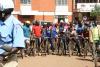 Riders line up at the start in downtown Kitale